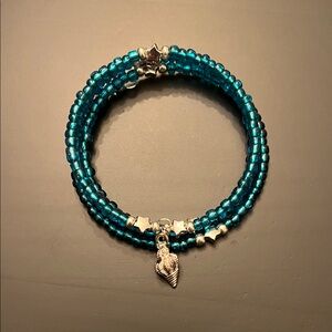 Hand Crafted Teal Beaded Bracelet with Silver Charms